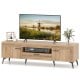 TV stand in oak finish with 2 cabinets and storage drawer, designed for 65-inch TVs, featuring sleek handles and cable.
