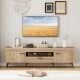 TV stand in oak finish with 2 cabinets and storage drawer, designed for 65-inch TVs, offering ample storage and cable.