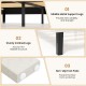 Close-up of the sturdy inclined legs of the beige velvet bed frame, featuring non-slip foot pads for floor protection.