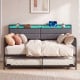 Twin size daybed with trundle and upholstered headboard, featuring RGB LED lights for a cozy atmosphere.
