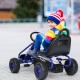 Child riding a blue pedal-powered go-kart with adjustable seat, featuring non-slip wheels and a handbrake for safety.