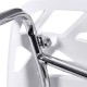 Close-up of the chrome frame of a modern accent chair with a cut-out tree design, ideal for indoor or outdoor use.