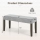 End of bed bench with gray padded seat, solid wood legs, and dimensions of 42"x15.5"x20", supports up to 800 lbs.