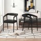 Set of 2 black upholstered armchairs with ergonomic backrests and padded seats, ideal for dining or relaxing.