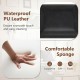 Close-up of waterproof PU leather and comfortable sponge of a black upholstered armchair, ideal for dining or.