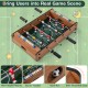 Mini foosball table with 12 players, 4 steel rods, and score trackers for intense tabletop soccer fun at home or.