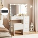 Vanity desk with lighted mirror and power outlets, featuring ample storage and a padded stool for makeup application.