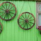 Decorative vintage wood wagon wheels made of Chinese fir, featuring a retro design, ideal for backyard or studio decor.
