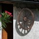 Decorative vintage wood wagon wheel made of Chinese fir, featuring a retro style, ideal for backyards or studios.