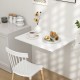 Wall-mounted drop-leaf table in sleek white finish, perfect for small spaces, folds flat for easy storage and.