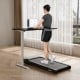 Walking pad in black with remote control, supporting 300 lbs, ideal for home workouts and walking while working.