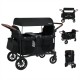 Wagon stroller for 4 kids in black with removable canopy, adjustable handles, and multiple storage pockets for.