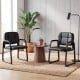 Set of 2 leather office reception chairs with cushioned seats and ergonomic backrests, ideal for waiting rooms.