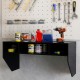 Wall-mounted black computer desk with 3 storage compartments, ideal for organizing workspace and saving floor space.