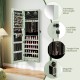 Wall-mounted green jewelry cabinet with full-length mirror, LED lights, and spacious storage for organized accessories.