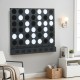 Wall-mounted Jumbo 4-in-a-Row game features black acrylic discs, perfect for garages and game rooms for all ages.