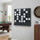 Wall-mounted metal Connect-4 game in black features sleek acrylic discs and a bottom tray for easy play and reset.