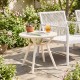 Weather-resistant circular small end table with a 20" round tabletop, perfect for poolside or balcony use.