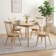 Set of four Windsor dining chairs in natural rubber wood, featuring a swivel seat and spindle back for comfort.
