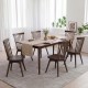 Set of four walnut Windsor dining chairs with swivel seats, featuring solid rubber wood construction and inclined.