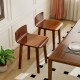 Set of 2 brown acacia wood dining chairs with curved seats and low backrests, perfect for kitchen or dining room use.
