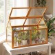 Wood cold frame greenhouse with adjustable roof, transparent panels, and solid fir wood frame for plant protection.