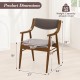Wooden dining chair with padded seat and back in walnut finish, featuring ergonomic armrests and dimensions for comfort.