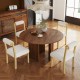 Round wooden dining table with four white faux sherpa chairs, showcasing rustic charm and modern elegance for dining.