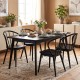 Black wooden dining chair set featuring high spindle backs and wide seats, perfect for dining rooms and cafes.