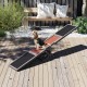 Wooden dog agility seesaw in gray with textured surfaces, perfect for outdoor training and exercise for dogs.