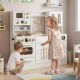 Wooden kids kitchen playset in white with realistic lights and sounds, featuring stoves, sink, and ample storage for.