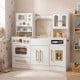 Wooden kids kitchen playset in white with realistic lights, sounds, and ample storage for imaginative play.