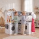 Children engaging in imaginative play at the wooden kids play kitchen, featuring a lighted stovetop and realistic.
