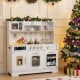 Wooden play kitchen for kids in white with realistic lights, sounds, and multiple accessories for imaginative play.