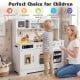 Wooden play kitchen for kids in white featuring realistic lights, sounds, and various cooking accessories for.