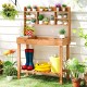 Wooden potting bench with 3-tier shelf and flip-up tabletop, perfect for gardening tasks in patios or gardens.