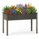 Elevated wooden vegetable garden bed in gray filled with colorful flowers, ideal for backyard or patio planting.