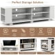 Wooden TV stand in white with 8 open shelves, designed for TVs up to 65 inches, perfect for living room storage.