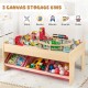 Wooden train set table with reversible tabletops and 3 fabric storage bins for organized playtime fun.