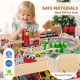 Wooden train set table with reversible tabletops, 94 accessories, and safe rounded edges for kids' imaginative play.