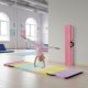 Gymnastics mat with colorful sections and a folding balance beam, ideal for yoga and gymnastics training.
